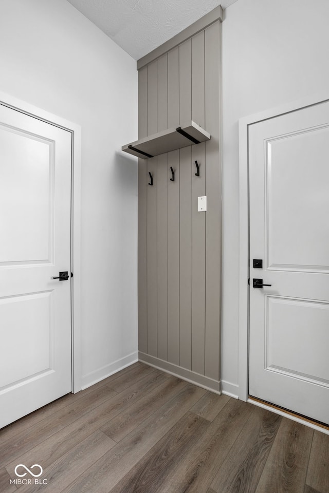 mudroom with light hardwood / wood-style flooring