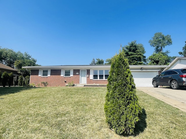 single story home with concrete driveway, a front lawn, an attached garage, and brick siding