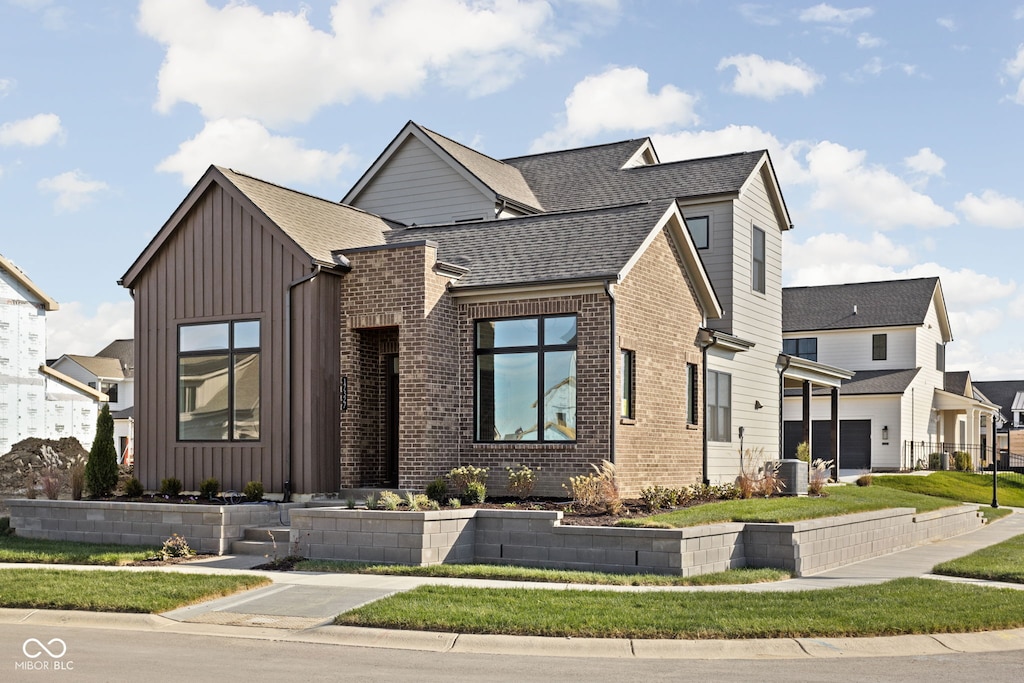 view of front of home featuring central air condition unit