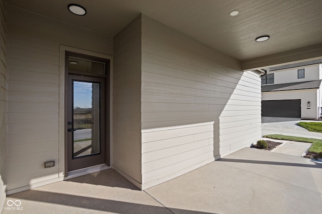 view of exterior entry featuring a garage