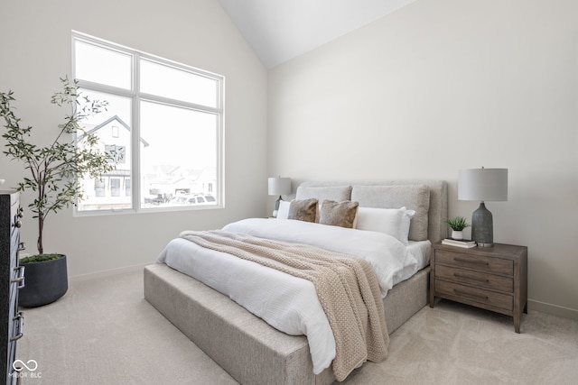 carpeted bedroom featuring vaulted ceiling