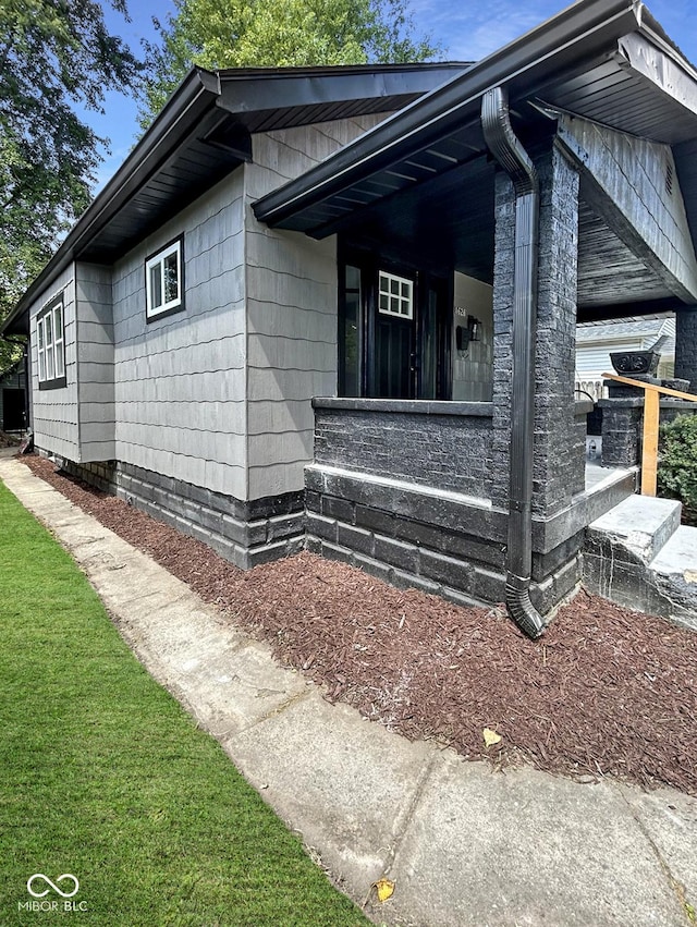 view of home's exterior featuring a lawn