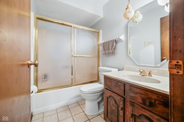 full bathroom with tile patterned flooring, vanity, toilet, and shower / bath combination with glass door