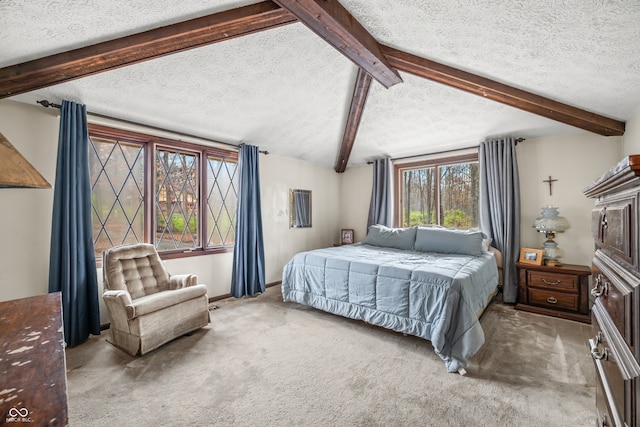 bedroom with lofted ceiling with beams, a textured ceiling, and carpet floors