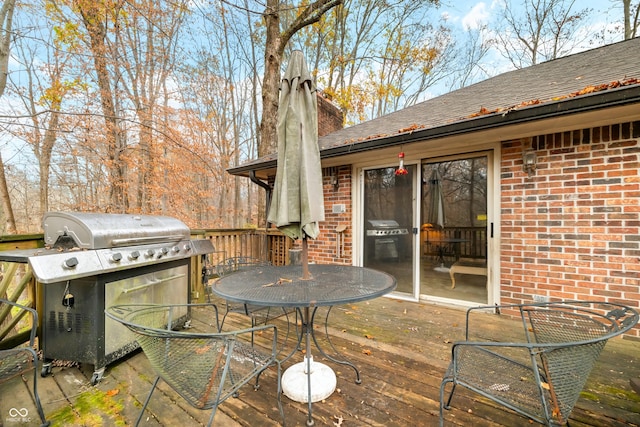 wooden deck featuring grilling area