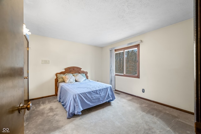 carpeted bedroom with a textured ceiling