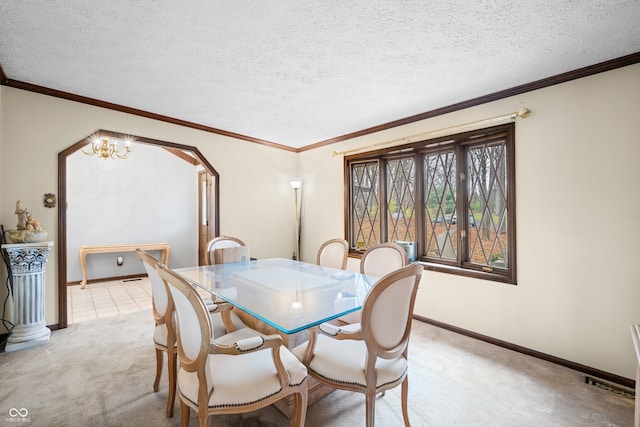 dining space featuring crown molding, light colored carpet, a textured ceiling, and a chandelier