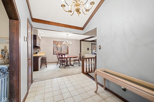 interior space with vaulted ceiling and a notable chandelier