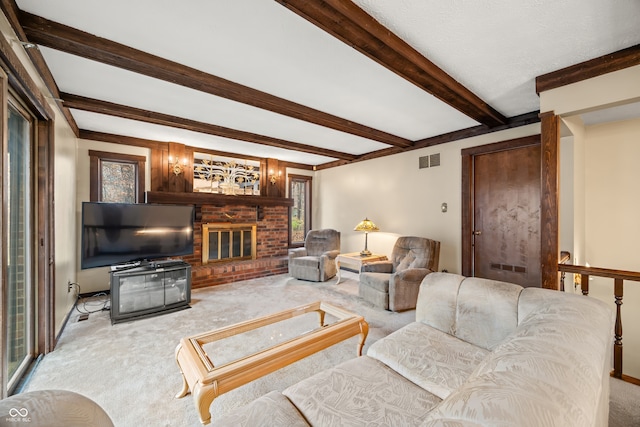 living room featuring light carpet, a brick fireplace, and beamed ceiling