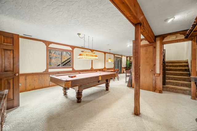 playroom featuring wooden walls, light colored carpet, a textured ceiling, and pool table