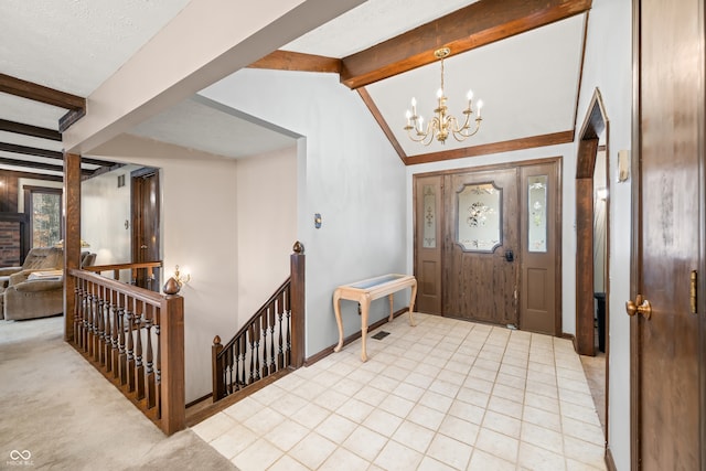 foyer entrance with a textured ceiling, lofted ceiling with beams, light carpet, and a chandelier