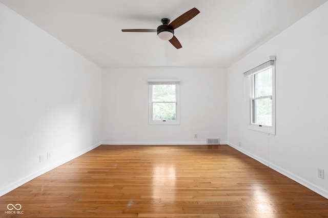 unfurnished room with light hardwood / wood-style floors and ceiling fan