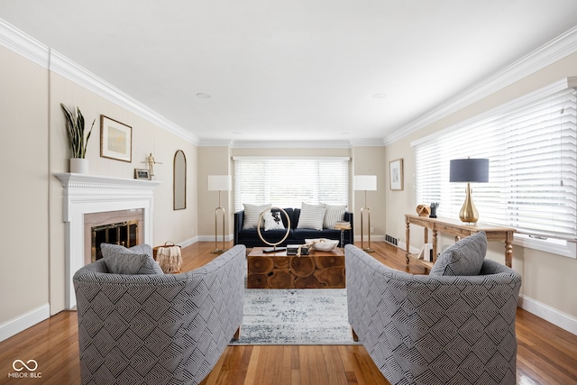 living room with hardwood / wood-style floors and crown molding