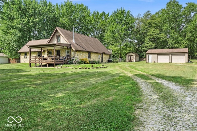 view of yard with a storage shed and a wooden deck