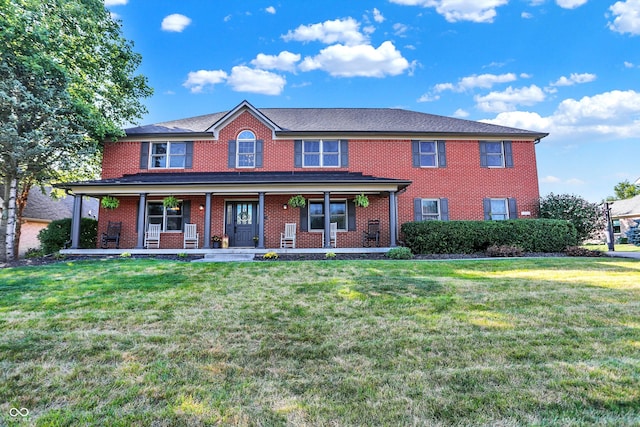 view of front of house with a front lawn and covered porch