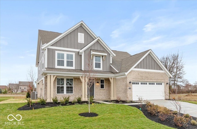 craftsman-style home with a front lawn, central AC unit, and a garage