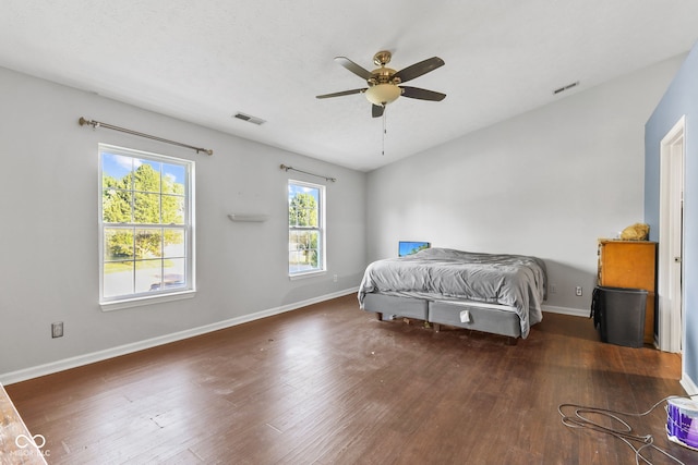 bedroom featuring ceiling fan and dark wood-type flooring