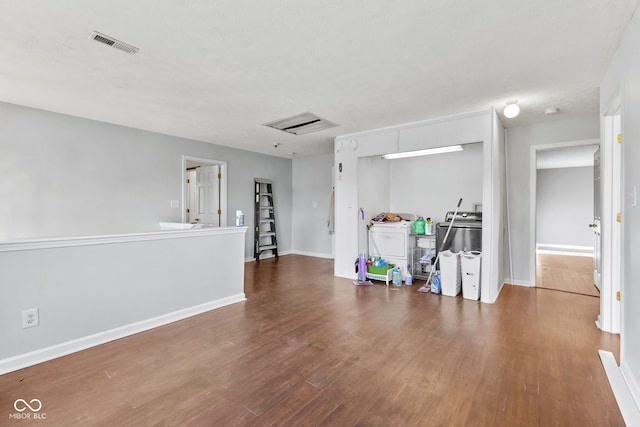 interior space with visible vents, dark wood finished floors, and baseboards