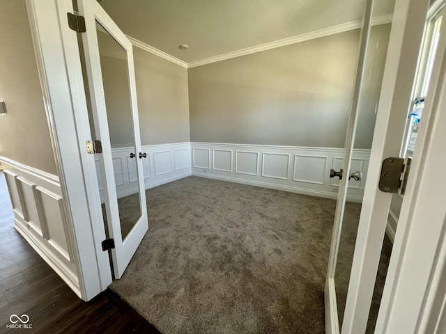 carpeted spare room featuring ornamental molding