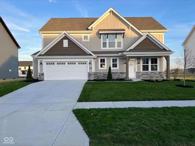 craftsman-style home featuring a garage and a front lawn