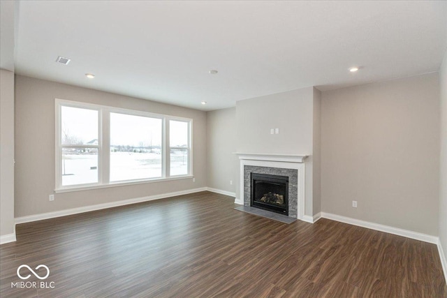 unfurnished living room featuring dark wood-type flooring