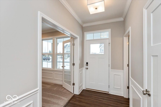 entryway featuring ornamental molding, dark hardwood / wood-style flooring, and a wealth of natural light