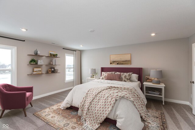 bedroom featuring multiple windows and carpet floors