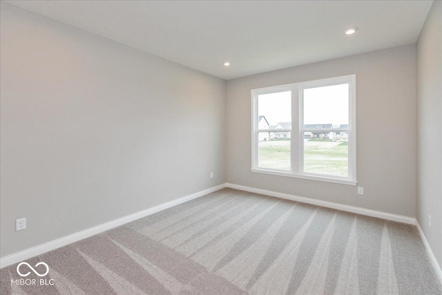 unfurnished room featuring baseboards, carpet floors, and recessed lighting