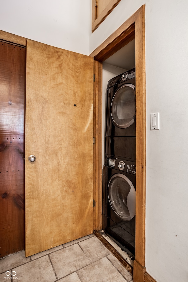 laundry area with stacked washer and clothes dryer