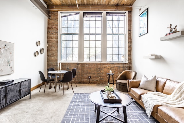 living area featuring wood ceiling and a wealth of natural light