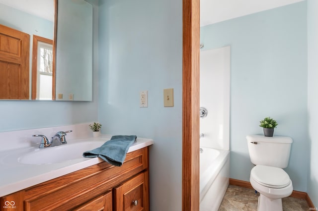 full bathroom featuring toilet, baseboards, and vanity