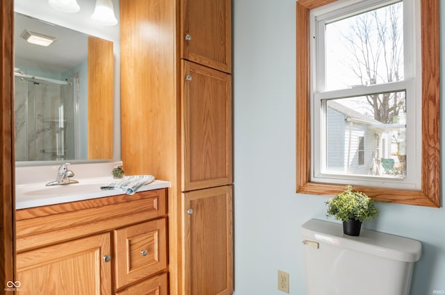 full bathroom with toilet, a shower stall, visible vents, and vanity