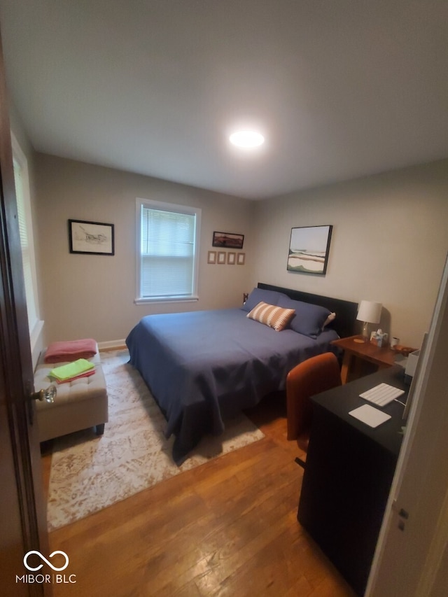 bedroom featuring wood finished floors