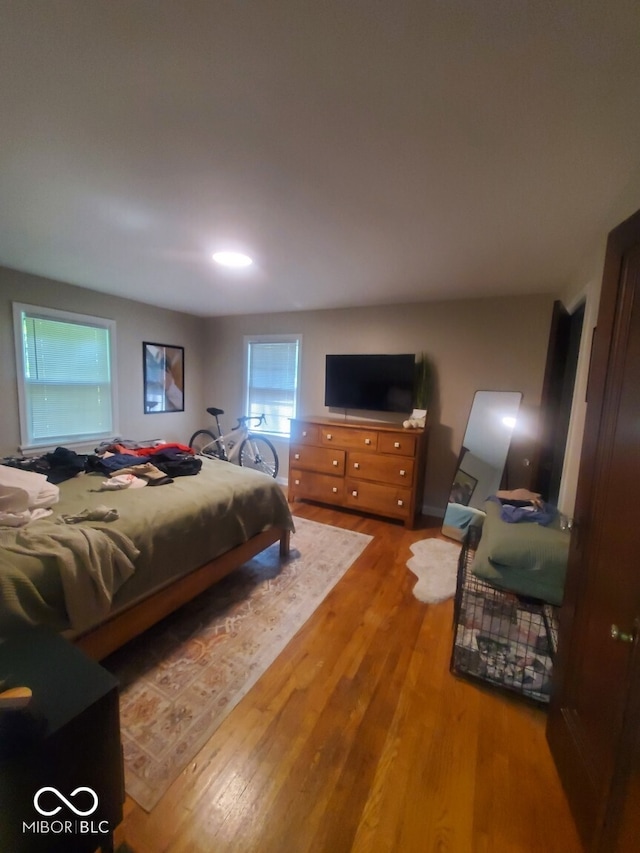 bedroom featuring wood finished floors