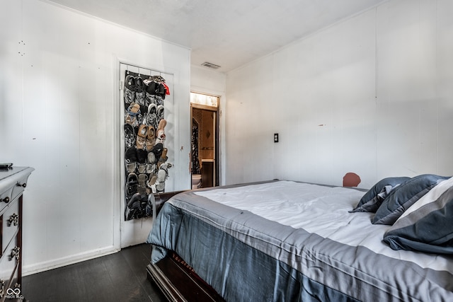 bedroom with a closet and wood-type flooring