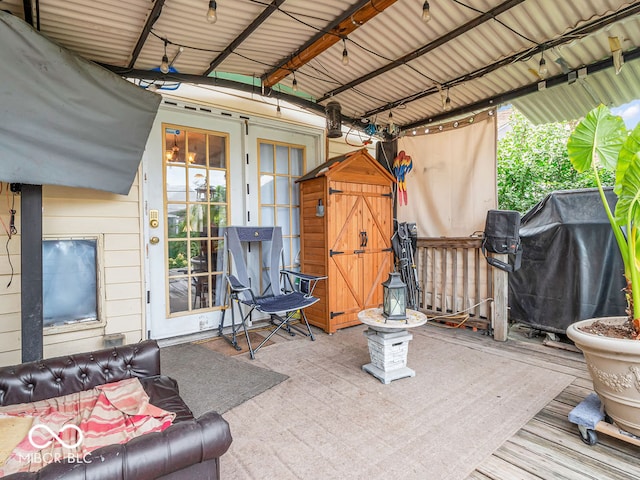 exterior space with a deck and a grill