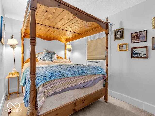 carpeted bedroom featuring wood ceiling, a textured ceiling, and cooling unit