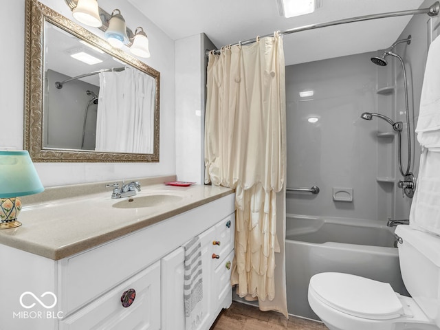 full bathroom featuring hardwood / wood-style flooring, shower / bath combo with shower curtain, vanity, and toilet