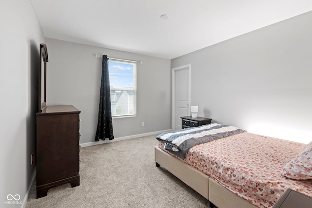 bedroom with light carpet