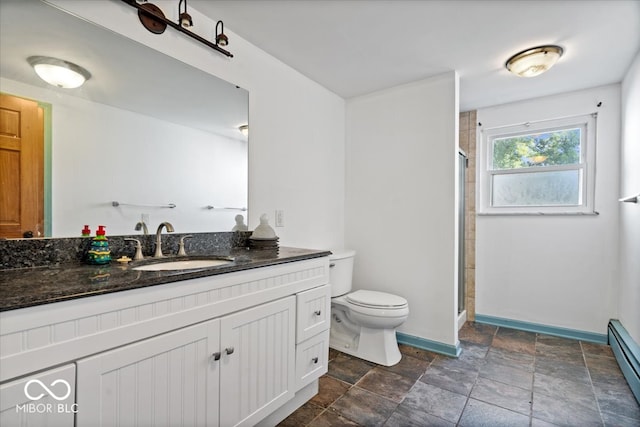 bathroom featuring vanity, baseboard heating, toilet, and an enclosed shower