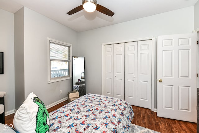 bedroom featuring a closet, ceiling fan, and dark hardwood / wood-style floors