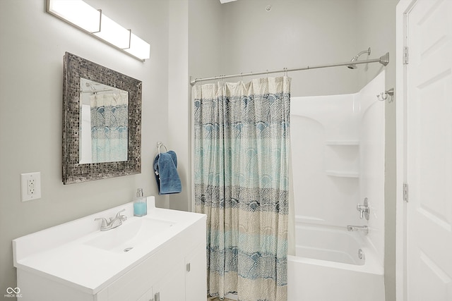 bathroom featuring shower / tub combo and vanity