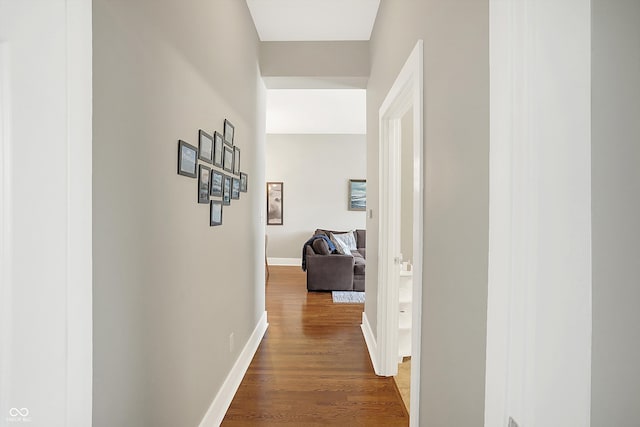 hall with wood-type flooring