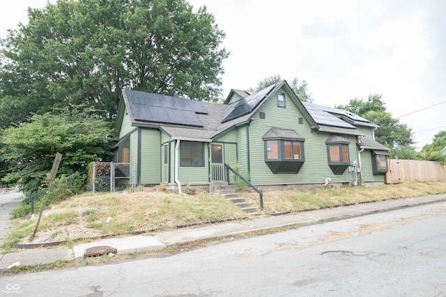 bungalow-style home with solar panels