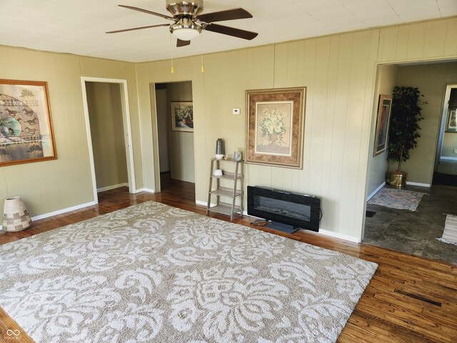 bedroom featuring dark wood-type flooring and ceiling fan