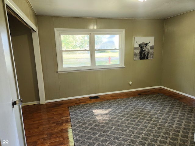 empty room featuring dark hardwood / wood-style floors