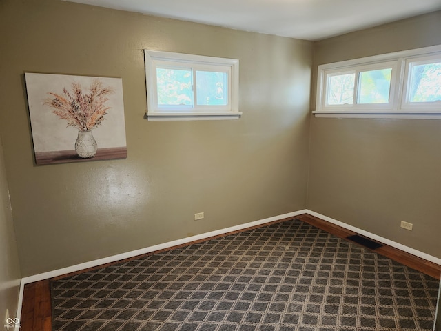 empty room featuring wood-type flooring