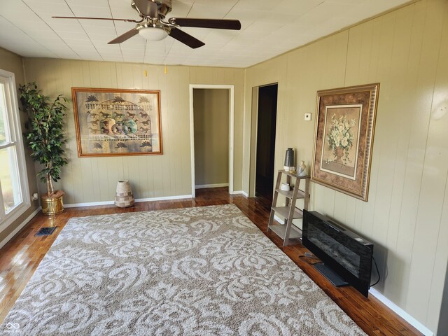 unfurnished room with ceiling fan and dark hardwood / wood-style floors