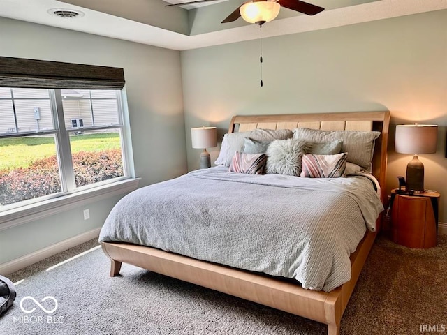 bedroom featuring ceiling fan and carpet