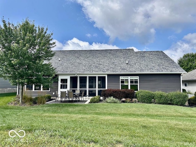 back of property featuring a patio area and a lawn